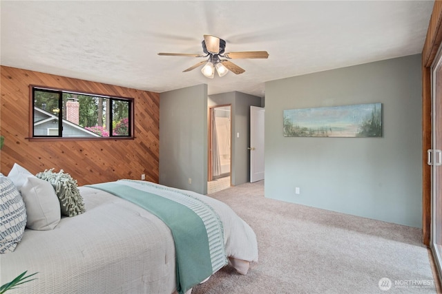 16044 33rd Ave NE, Lake Forest Park, WA 98155 - carpeted bedroom with wooden walls, ceiling fan, and connected bathroom