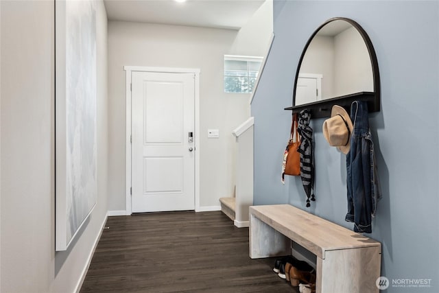 mudroom with dark wood-style flooring and baseboards