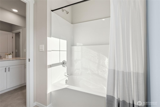 full bathroom featuring vanity, shower / bath combo, and baseboards