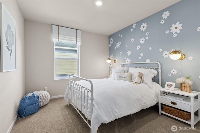bedroom featuring baseboards and carpet