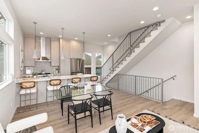 2925 Franklin Ave E Unit B, Seattle, WA 98102 - dining room featuring light wood-style flooring, recessed lighting, stairs, and baseboards