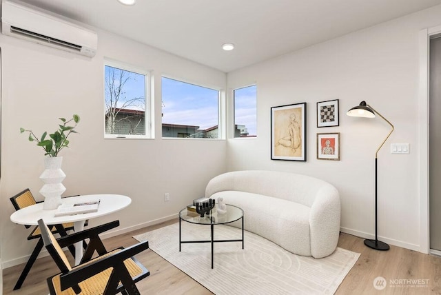 2925 Franklin Ave E Unit B, Seattle, WA 98102 - living area with a wall mounted AC, light wood-style floors, recessed lighting, and baseboards