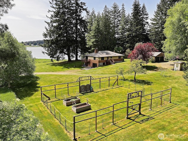 5066 Bayview Rd, Langley, WA 98260 - view of property's community featuring a gate, a water view, a garden, and an outbuilding