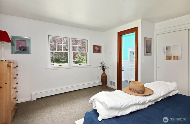 5066 Bayview Rd, Langley, WA 98260 - bedroom featuring a baseboard heating unit, carpet flooring, and baseboards