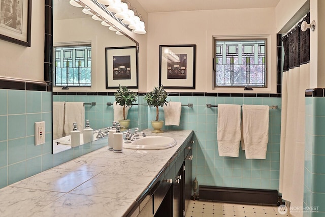 5066 Bayview Rd, Langley, WA 98260 - bathroom with tile walls, vanity, and a wainscoted wall
