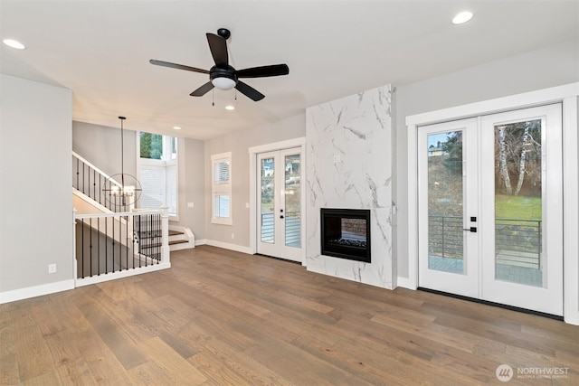 13041 75th Pl S, Seattle, WA 98178 - unfurnished living room featuring french doors, recessed lighting, wood finished floors, ceiling fan, and baseboards
