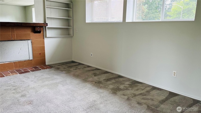 3732 S 254th Pl, Kent, WA 98032 - unfurnished living room featuring carpet floors, baseboards, and a fireplace