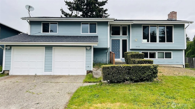 3732 S 254th Pl, Kent, WA 98032 - split foyer home with a chimney, concrete driveway, a garage, and a front lawn