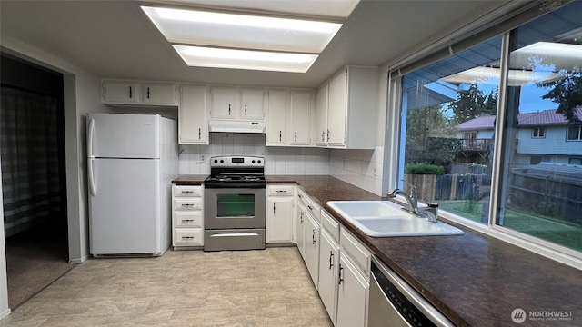3732 S 254th Pl, Kent, WA 98032 - kitchen with stainless steel appliances, under cabinet range hood, a sink, dark countertops, and white cabinets