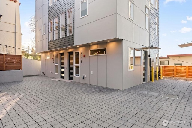 back of house featuring fence and a patio area