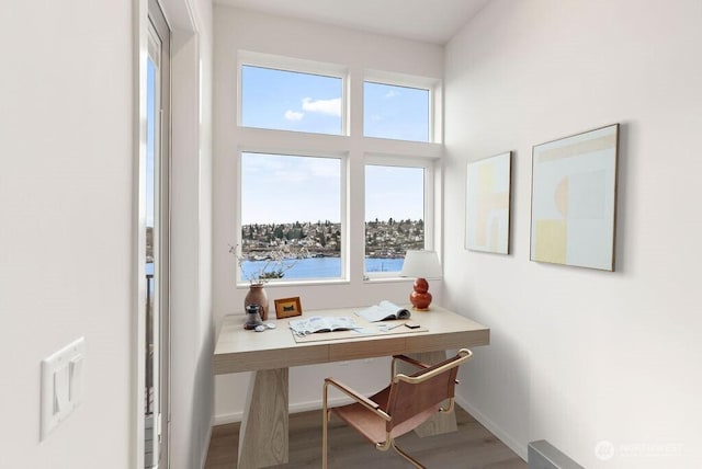 office area featuring wood finished floors and baseboards