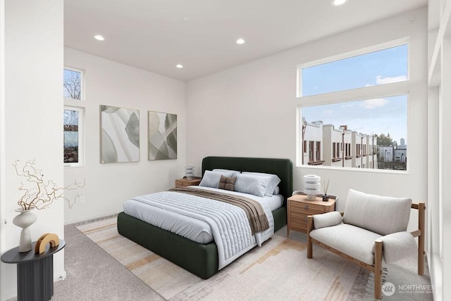 bedroom with recessed lighting and light colored carpet