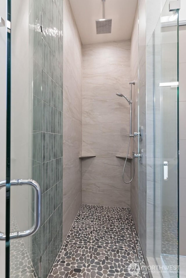 full bath with a shower stall