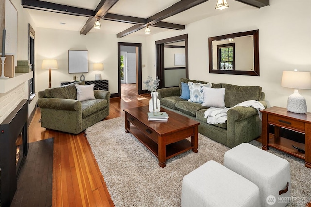 3227 37th Ave S, Seattle, WA 98144 - living area featuring a fireplace, wood-type flooring, beam ceiling, and ceiling fan