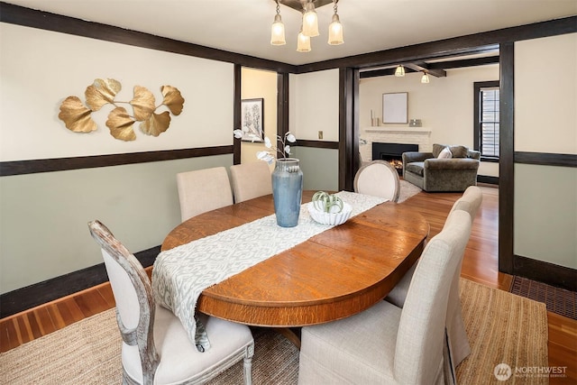3227 37th Ave S, Seattle, WA 98144 - dining area with wood finished floors and a brick fireplace
