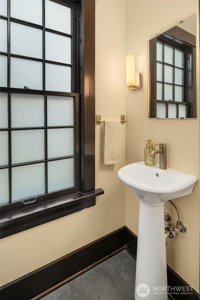 3227 37th Ave S, Seattle, WA 98144 - bathroom with baseboards and a sink