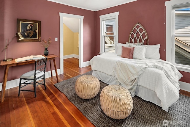 3227 37th Ave S, Seattle, WA 98144 - bedroom featuring hardwood / wood-style flooring, an office area, baseboards, ornamental molding, and multiple windows