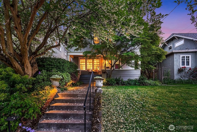 3227 37th Ave S, Seattle, WA 98144 - view of property hidden behind natural elements featuring a porch and a front yard