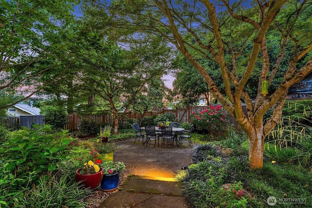 3227 37th Ave S, Seattle, WA 98144 - fenced backyard featuring a patio area and outdoor dining space
