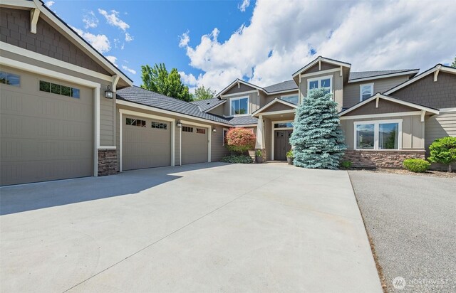 1400 Westpoint Pl, Wenatchee, WA 98801 - craftsman-style house with stone siding, an attached garage, and driveway