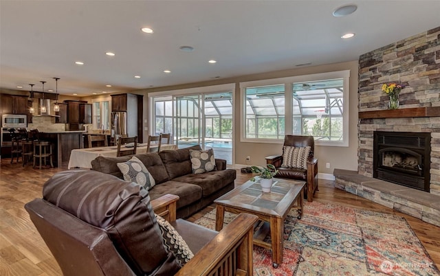 1400 Westpoint Pl, Wenatchee, WA 98801 - living area with healthy amount of natural light, recessed lighting, light wood-style floors, a fireplace, and baseboards