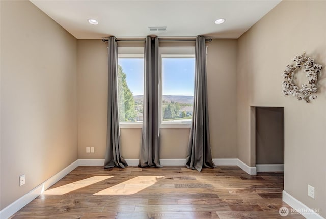 1400 Westpoint Pl, Wenatchee, WA 98801 - spare room with baseboards, wood finished floors, and recessed lighting