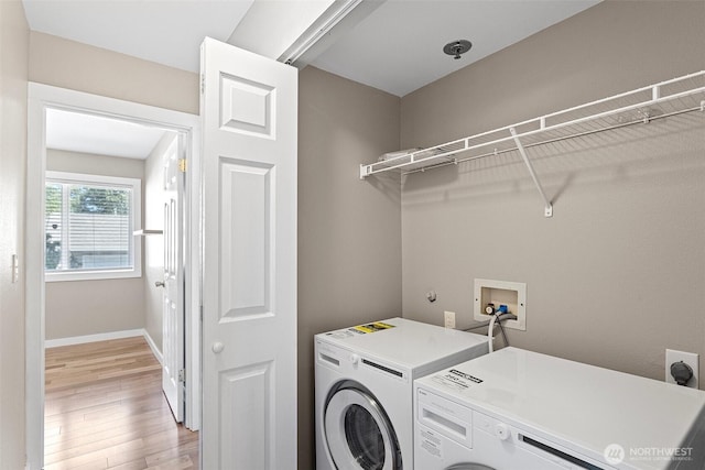 901 E Marine View Dr Unit 201, Everett, WA 98201 - laundry room featuring light wood-style flooring, washing machine and clothes dryer, and baseboards