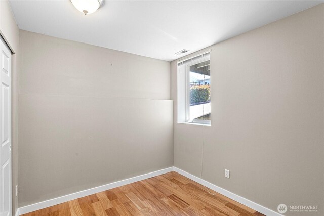 901 E Marine View Dr Unit 201, Everett, WA 98201 - spare room featuring light wood-style flooring and baseboards