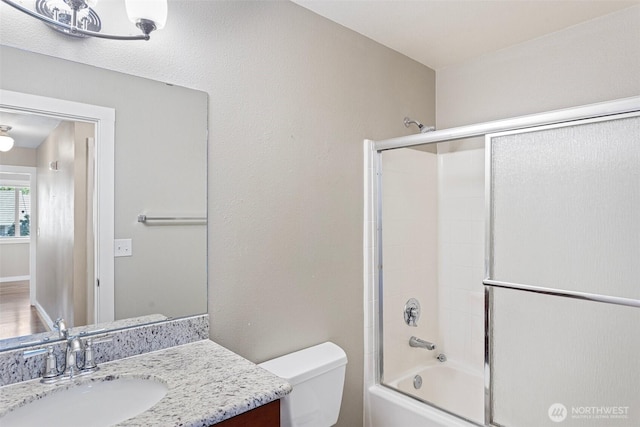 901 E Marine View Dr Unit 201, Everett, WA 98201 - full bath featuring vanity, shower / bath combination with glass door, and toilet