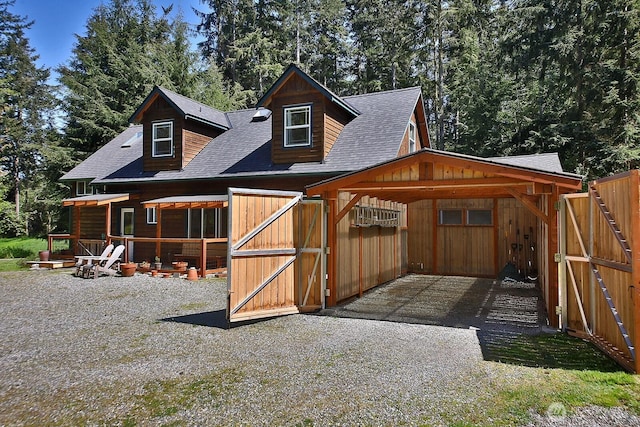 3425 Passage Way, Langley, WA 98260 - view of outdoor structure featuring an attached carport and driveway