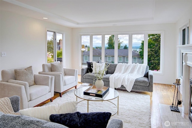 4539 E Laurel Dr NE, Seattle, WA 98105 - living area with a tray ceiling, wood finished floors, and recessed lighting