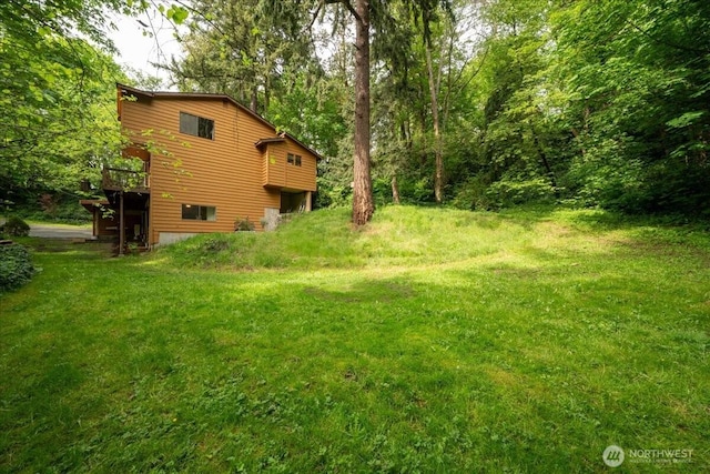 view of yard featuring a wooden deck