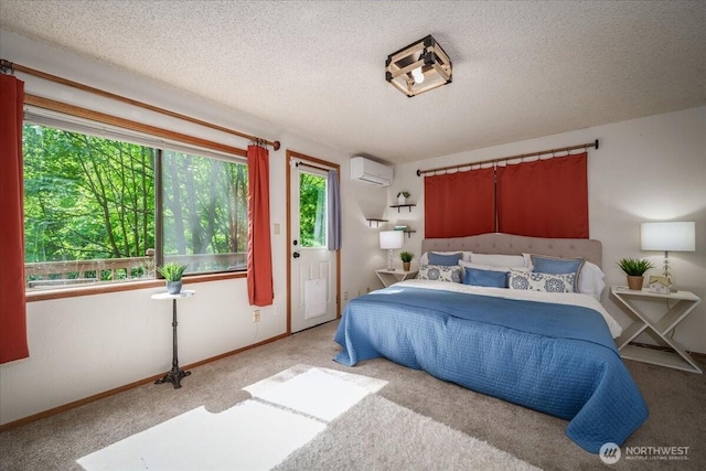 carpeted bedroom featuring a wall mounted air conditioner, a textured ceiling, and baseboards