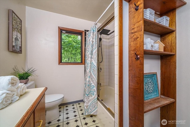 bathroom featuring toilet, shower / bath combo with shower curtain, vanity, tile patterned floors, and baseboards