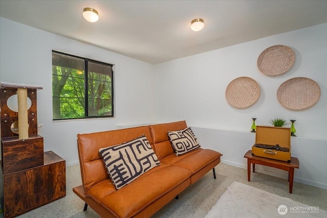 sitting room featuring baseboards