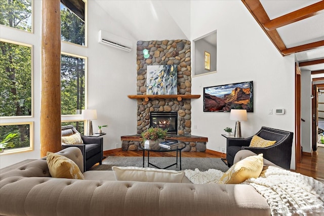8526 E Mercer Way, Mercer Island, WA 98040 - living area featuring a wall mounted AC, high vaulted ceiling, wood finished floors, and a fireplace
