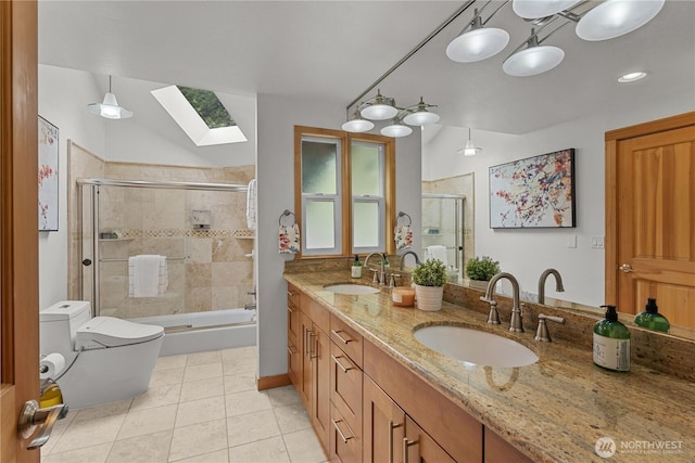 8526 E Mercer Way, Mercer Island, WA 98040 - full bathroom featuring a skylight, double vanity, tile patterned flooring, and shower / bath combination with glass door