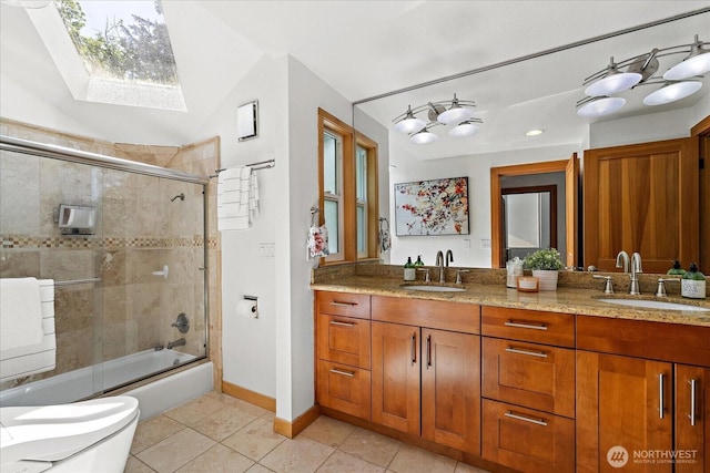 8526 E Mercer Way, Mercer Island, WA 98040 - bathroom with tile patterned floors, a skylight, double vanity, and enclosed tub / shower combo