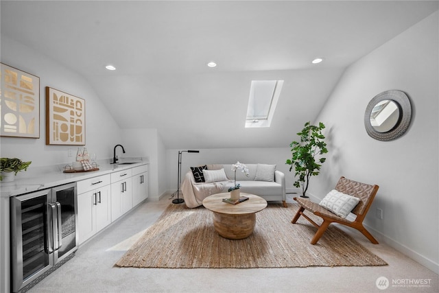 118 16th Ave, Seattle, WA 98122 - living room featuring beverage cooler, bar with sink, vaulted ceiling, recessed lighting, and baseboards