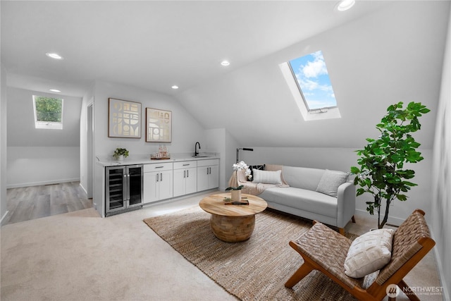 118 16th Ave, Seattle, WA 98122 - living room featuring bar with sink, wine cooler, recessed lighting, vaulted ceiling, and baseboards