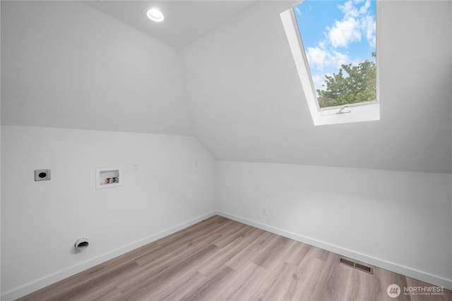 118 16th Ave, Seattle, WA 98122 - additional living space with vaulted ceiling, light wood-style floors, and baseboards