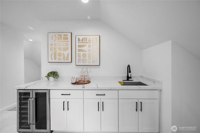 118 16th Ave, Seattle, WA 98122 - bar with beverage cooler, a sink, lofted ceiling, recessed lighting, and baseboards