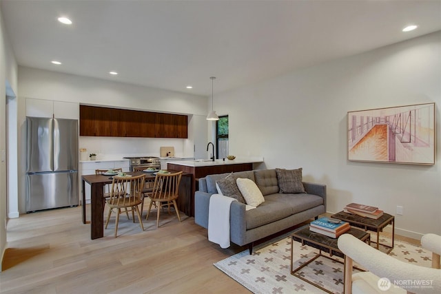 3816B 36th Ave W, Seattle, WA 98199 - living area with light wood finished floors, recessed lighting, and baseboards