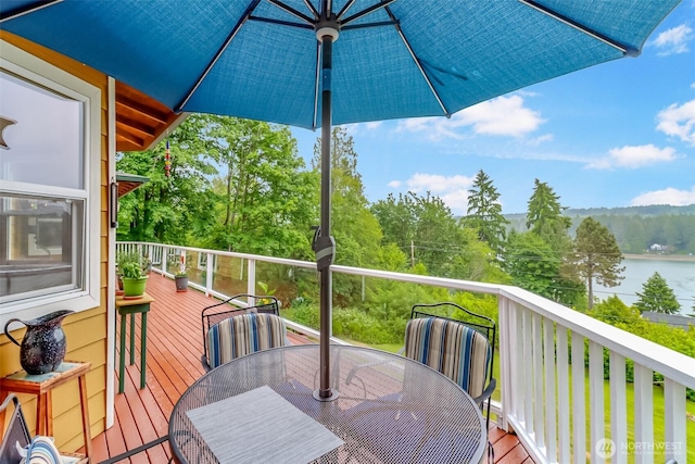 7509 145th St NW, Gig Harbor, WA 98329 - wooden deck featuring outdoor dining space and a water view