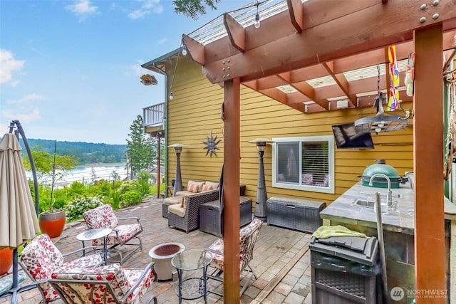 7509 145th St NW, Gig Harbor, WA 98329 - view of patio / terrace featuring an outdoor living space with a fire pit, a balcony, a pergola, and a water view
