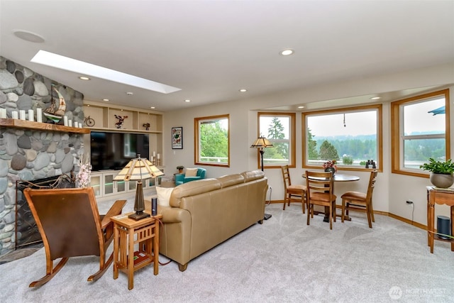 7509 145th St NW, Gig Harbor, WA 98329 - living room with a skylight, carpet, baseboards, and recessed lighting