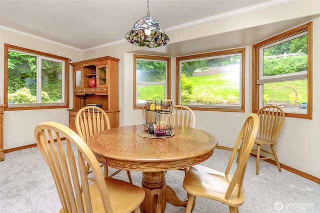 7509 145th St NW, Gig Harbor, WA 98329 - dining area with light colored carpet, baseboards, and crown molding