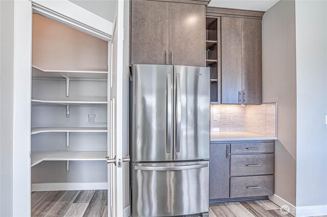 985 Spring Mountain Dr, Wenatchee, WA 98801 - kitchen featuring freestanding refrigerator, open shelves, light wood-style floors, backsplash, and light countertops