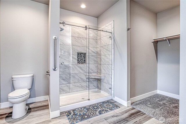 985 Spring Mountain Dr, Wenatchee, WA 98801 - full bathroom with a stall shower, wood finished floors, and recessed lighting