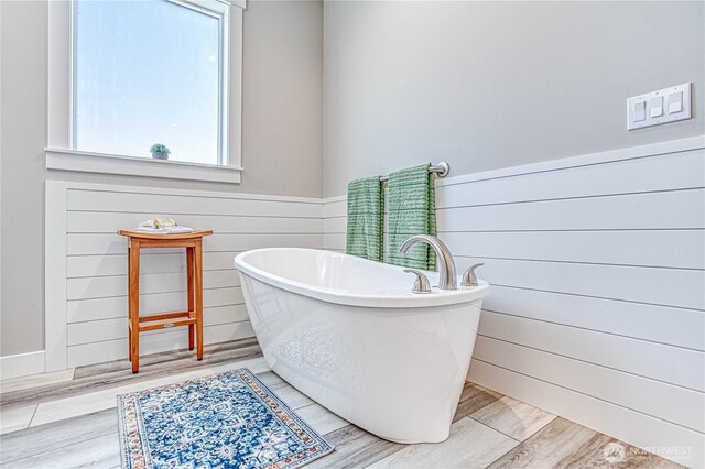 985 Spring Mountain Dr, Wenatchee, WA 98801 - full bathroom with a freestanding bath, wood finished floors, and wooden walls
